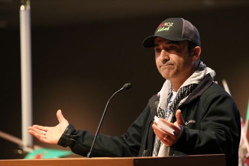 Kurdish American Nick Farko speaking - photograph by C.S. Hagen