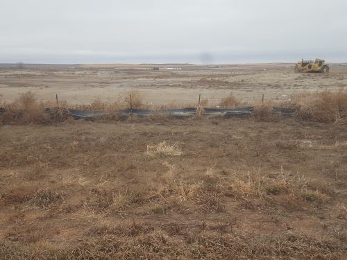 Proposed Davis Refinery site. The best little weed patch in Billings County. The earth mover has been sitting there since October of 2018. photo by Jim Fuglie