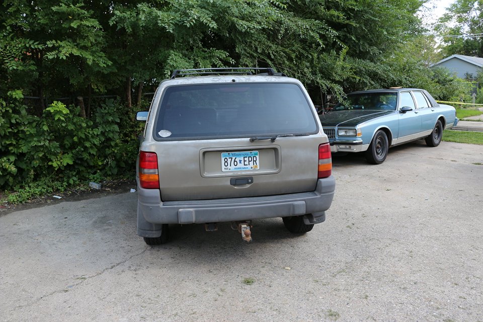 Brownish 1996 Grand Jeep Cherokee with a Minnesota license plate number 876 EPR