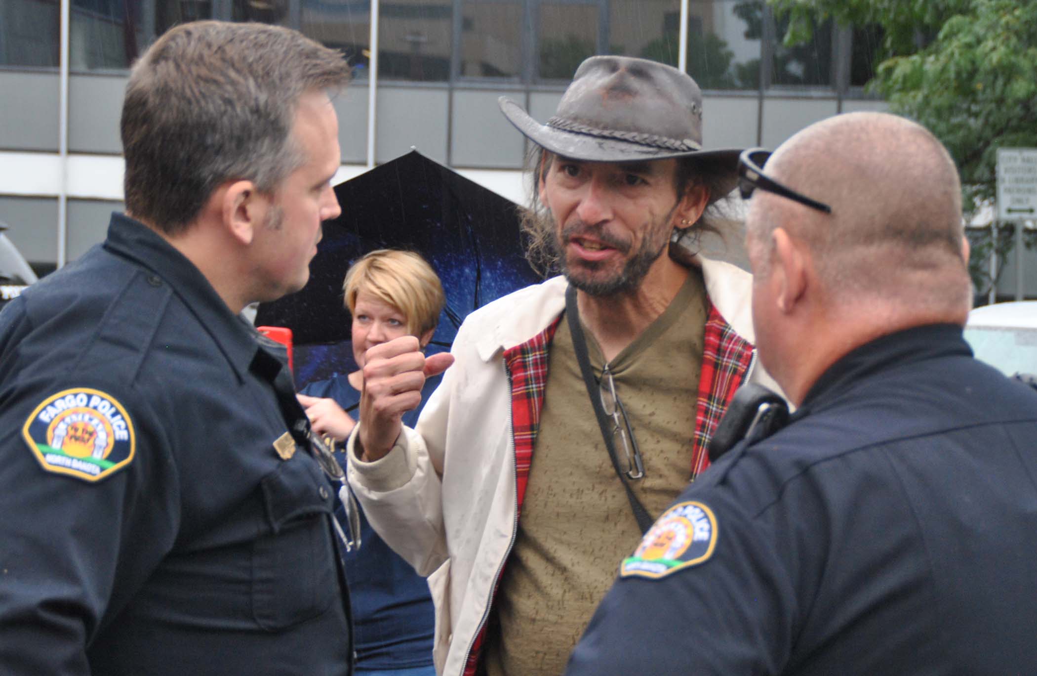 Kevin Benko talking to police - photo by C.S. Hagen