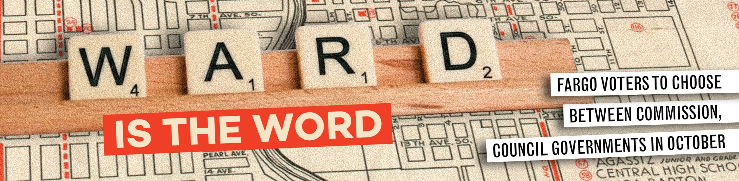 Scrabble tiles spelling WARD over Fargo city map