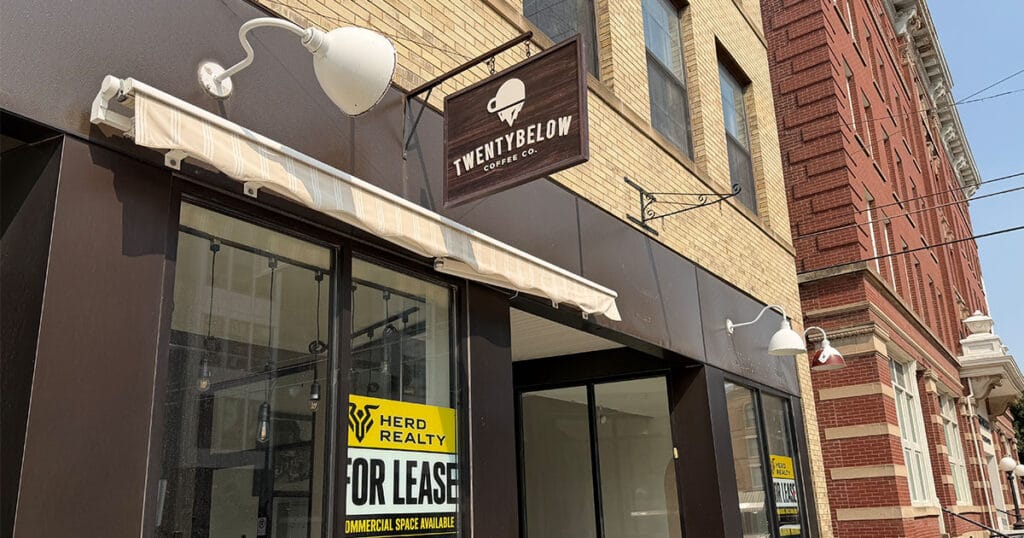 The shuttered Twenty Below Coffee Co. storefront in downtown Fargo, with a Herd Realty “For Lease” sign in the window.
