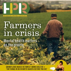HPR magazine cover featuring farmer walking through crop field